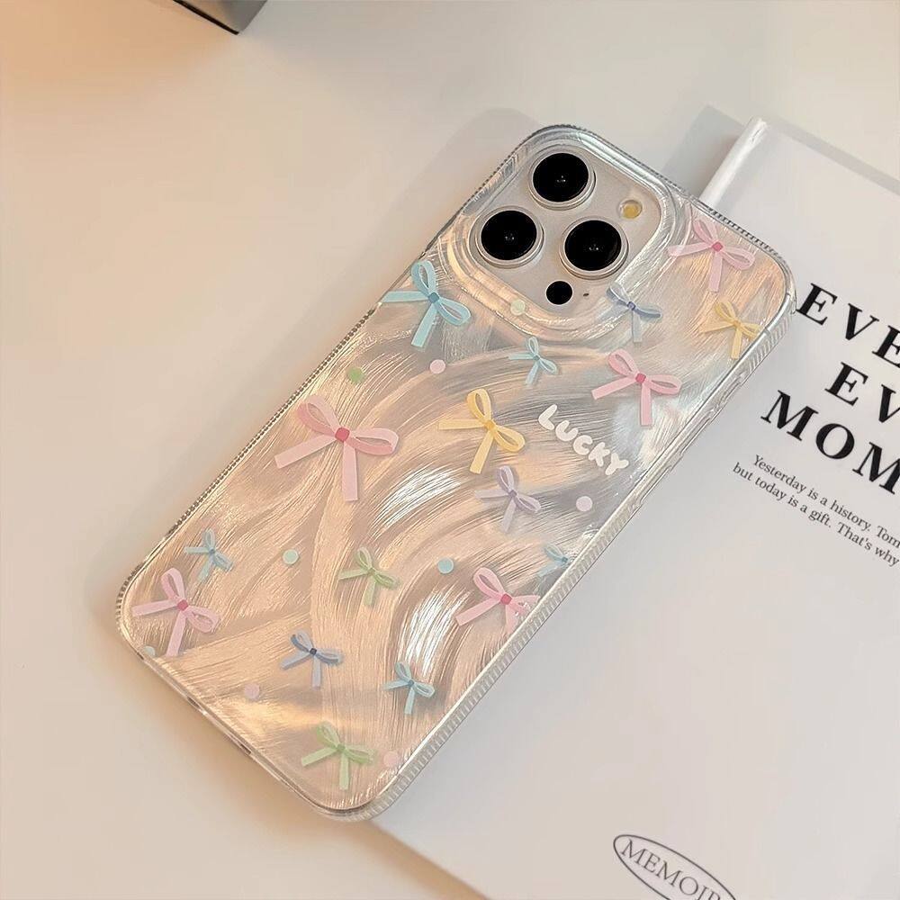 カラフルな弓シルバーレーザープリントケース OPPO リノ  - Oppo Reno 12 のレビューと価格